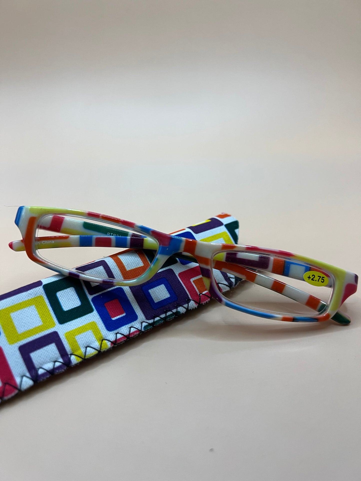 BRAND NEW GEOMETRIC NARROW READERS. FEATURES MULTI-COLOR DESIGN WITH MATCHING CASE