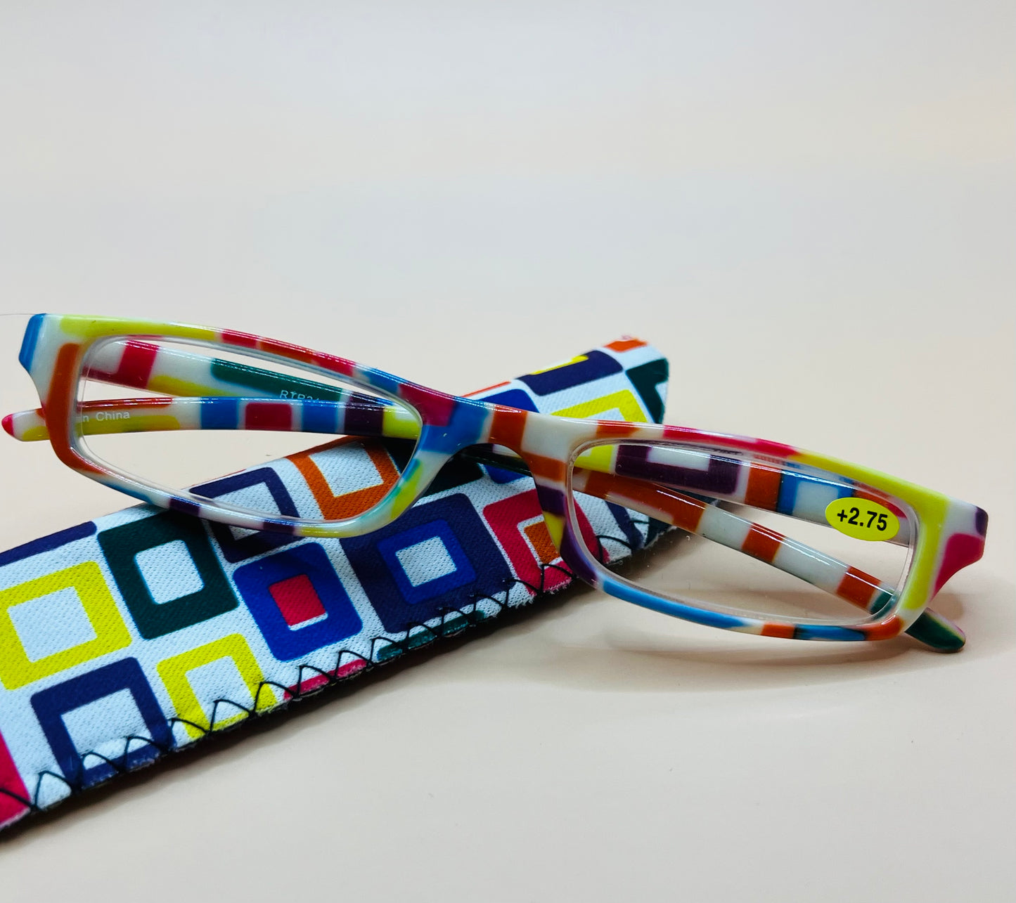 BRAND NEW GEOMETRIC NARROW READERS. FEATURES MULTI-COLOR DESIGN WITH MATCHING CASE