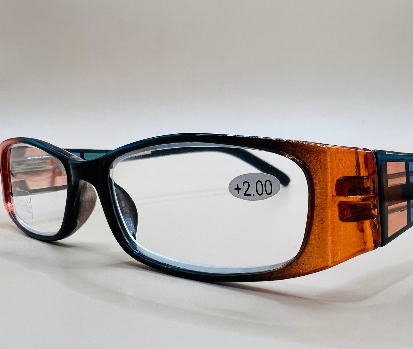 GEOMETRIC NARROW READERS.  BLACK FRAME FRONT WITH MULTI-COLOR ARMS