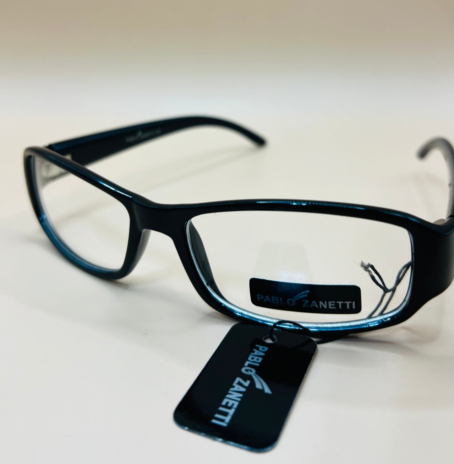 Pablo Zanetti rectangle frames.  Clear lenses, no magnification.   AFFORDABLE option to expense frames!