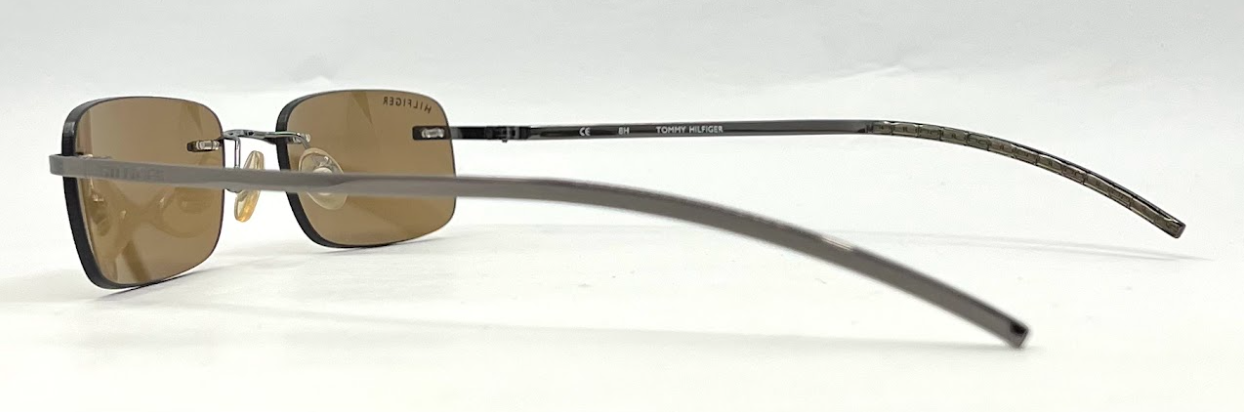 TOMMY HILFIGER TH 7007 Rimless Sunglasses–GUN Frame–Solid Brown Lenses–Unworn