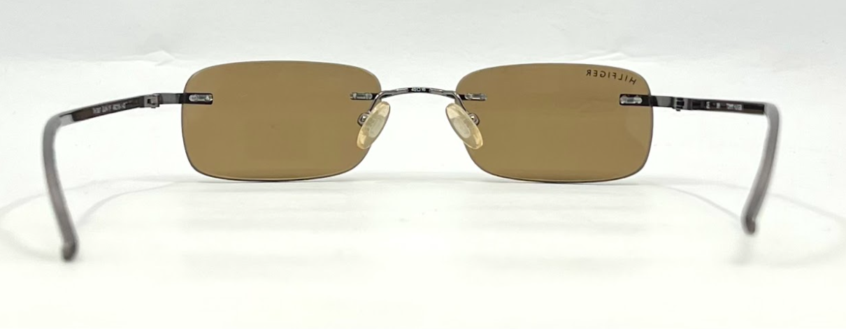 TOMMY HILFIGER TH 7007 Rimless Sunglasses–GUN Frame–Solid Brown Lenses–Unworn
