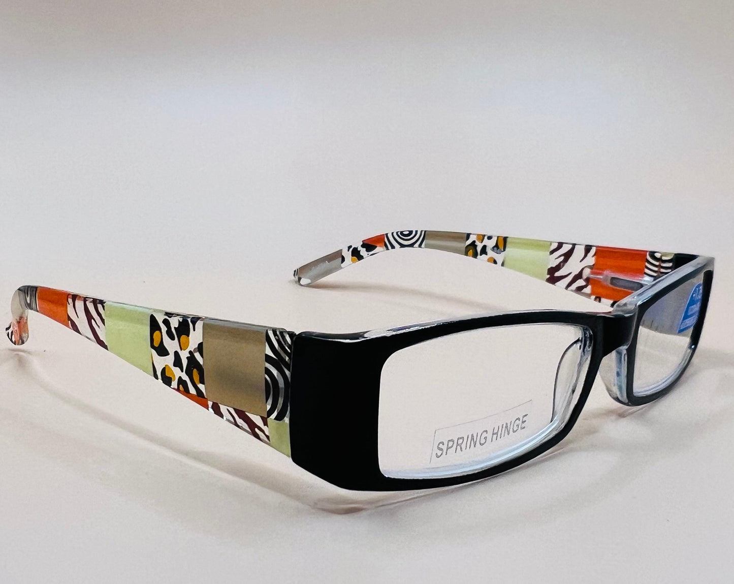 Sleek and stylish geometric narrow readers.  Featuring spring hinges in four colors with stylish arms and ultra thin Aspheric Lenses