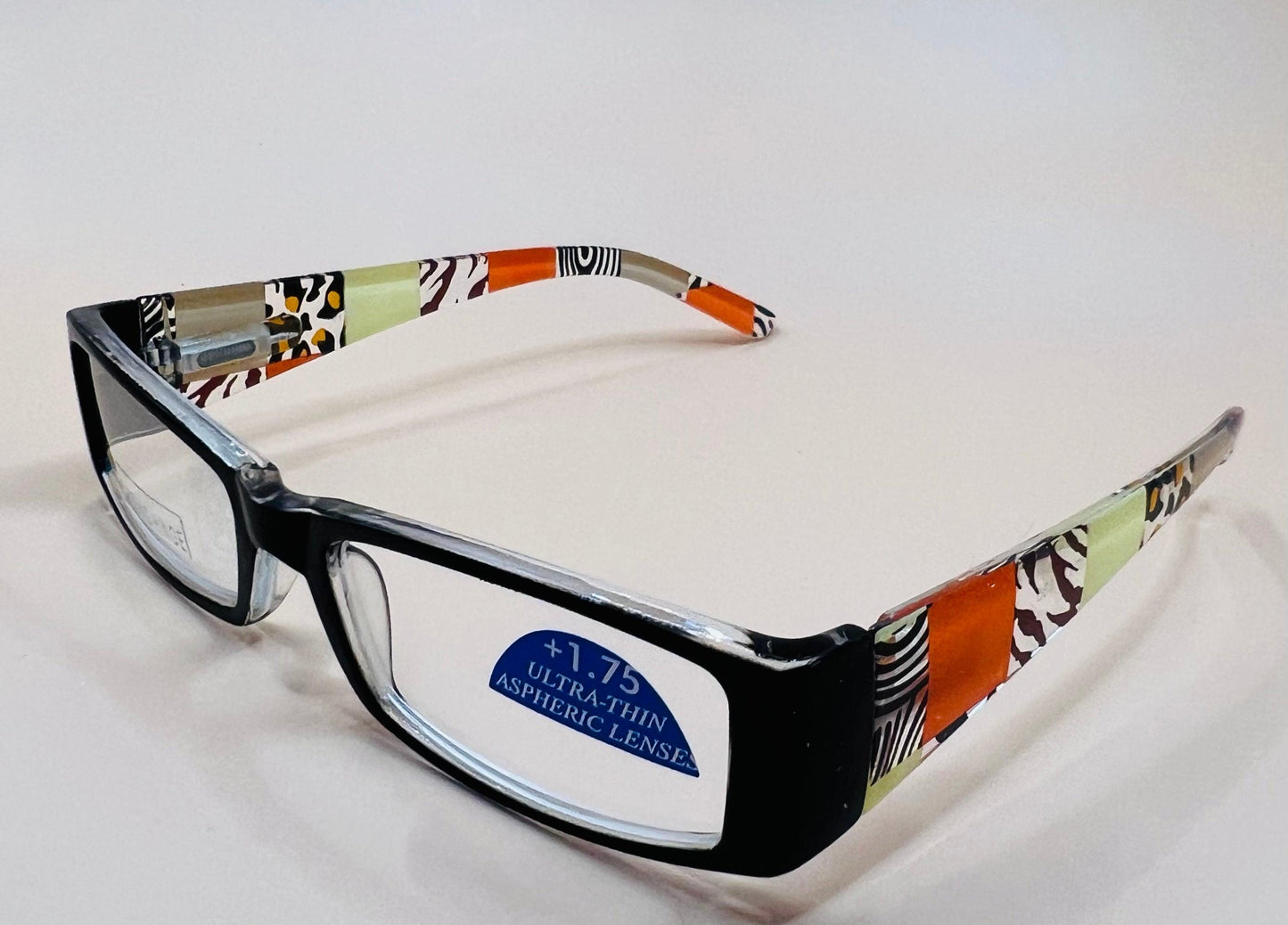 Sleek and stylish geometric narrow readers.  Featuring spring hinges in four colors with stylish arms and ultra thin Aspheric Lenses
