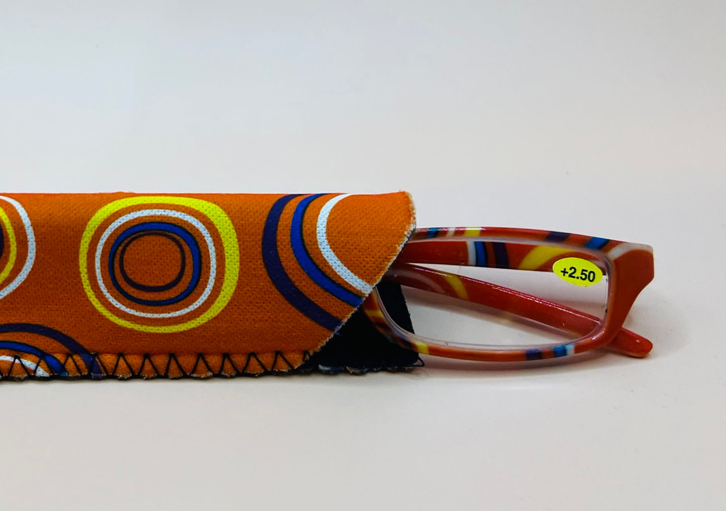 BRAND NEW  GEOMETRIC NARROW READERS.  ORANGE DESIGN WITH MATCHING CASE