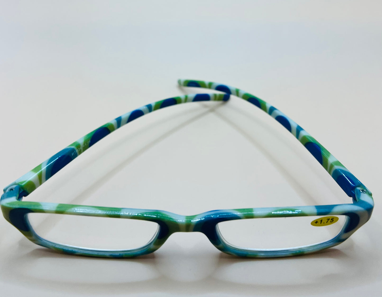 BRAND NEW GEOMETRIC NARROW READERS.  FEATURING A BLUE/GREEN MULTI-COLOR DESIGN WITH MATCHING CASE